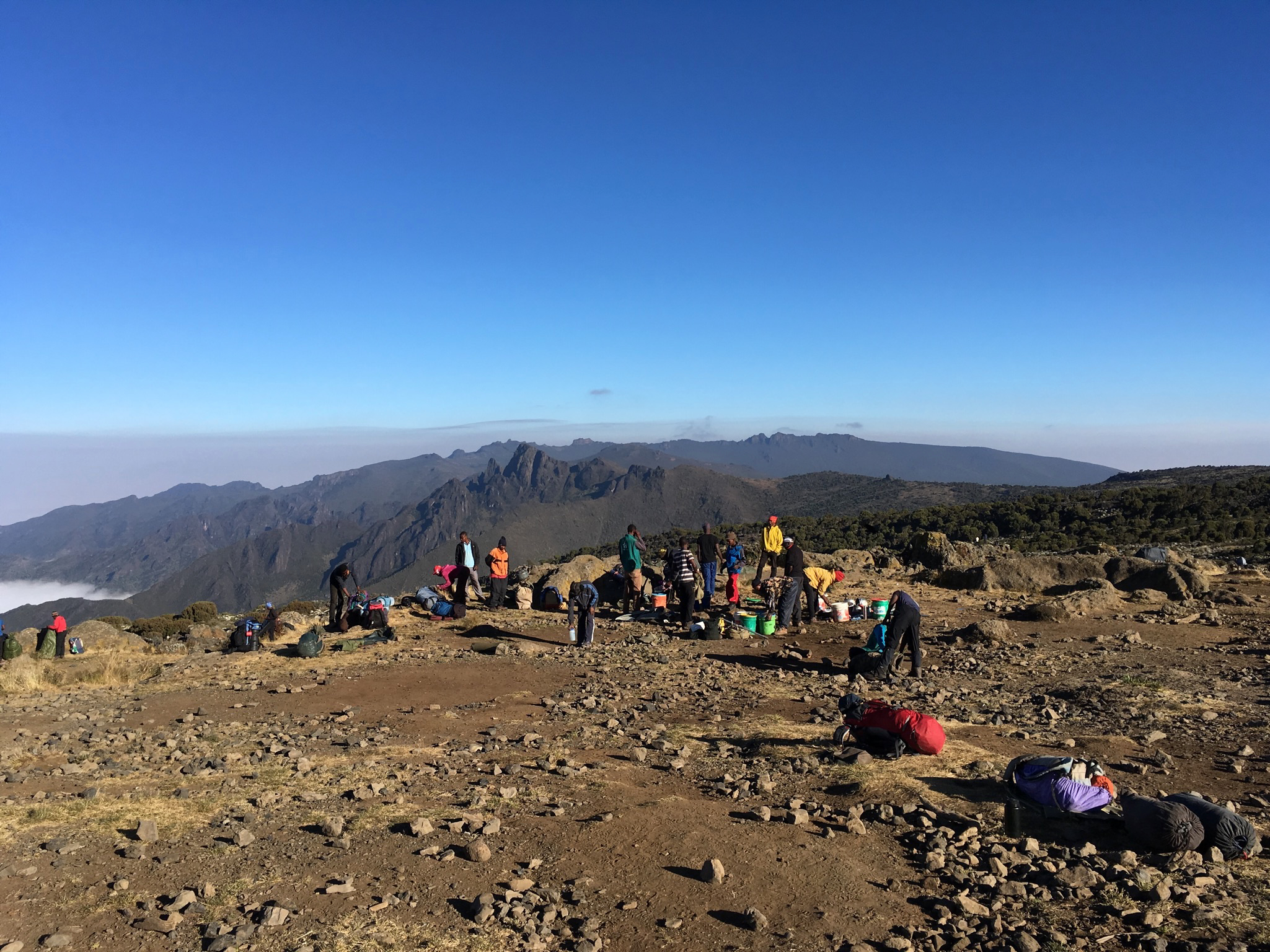 A photograph of porters setting up camp on Mount Kilimanjaro
