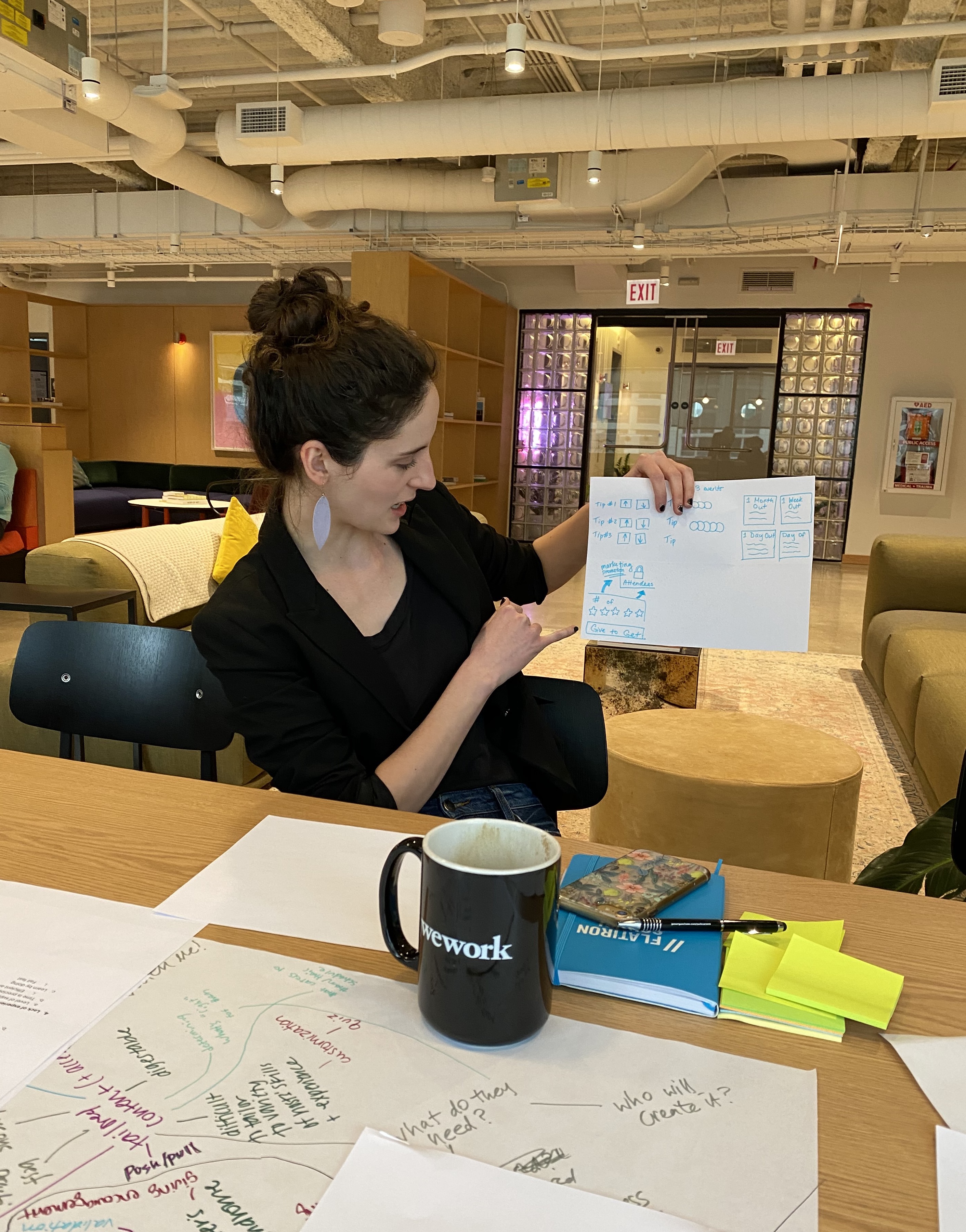 An image of the author, displaying a sketch while talking through it.